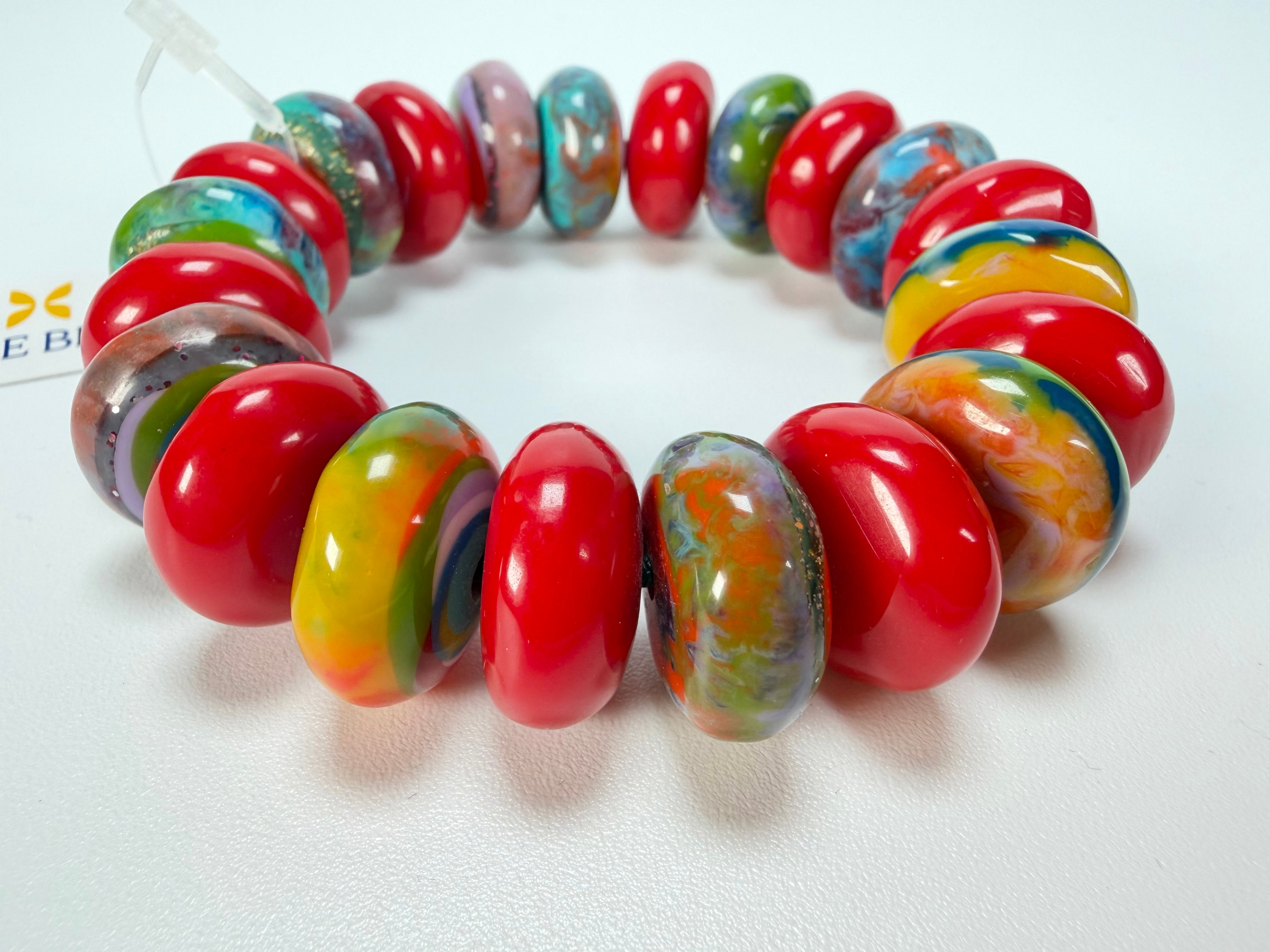 Jackie Brazil "Bela" Red Gloss & Kandinsky Elasticated Mini Wheels Resin Bracelet ( B0920 )
