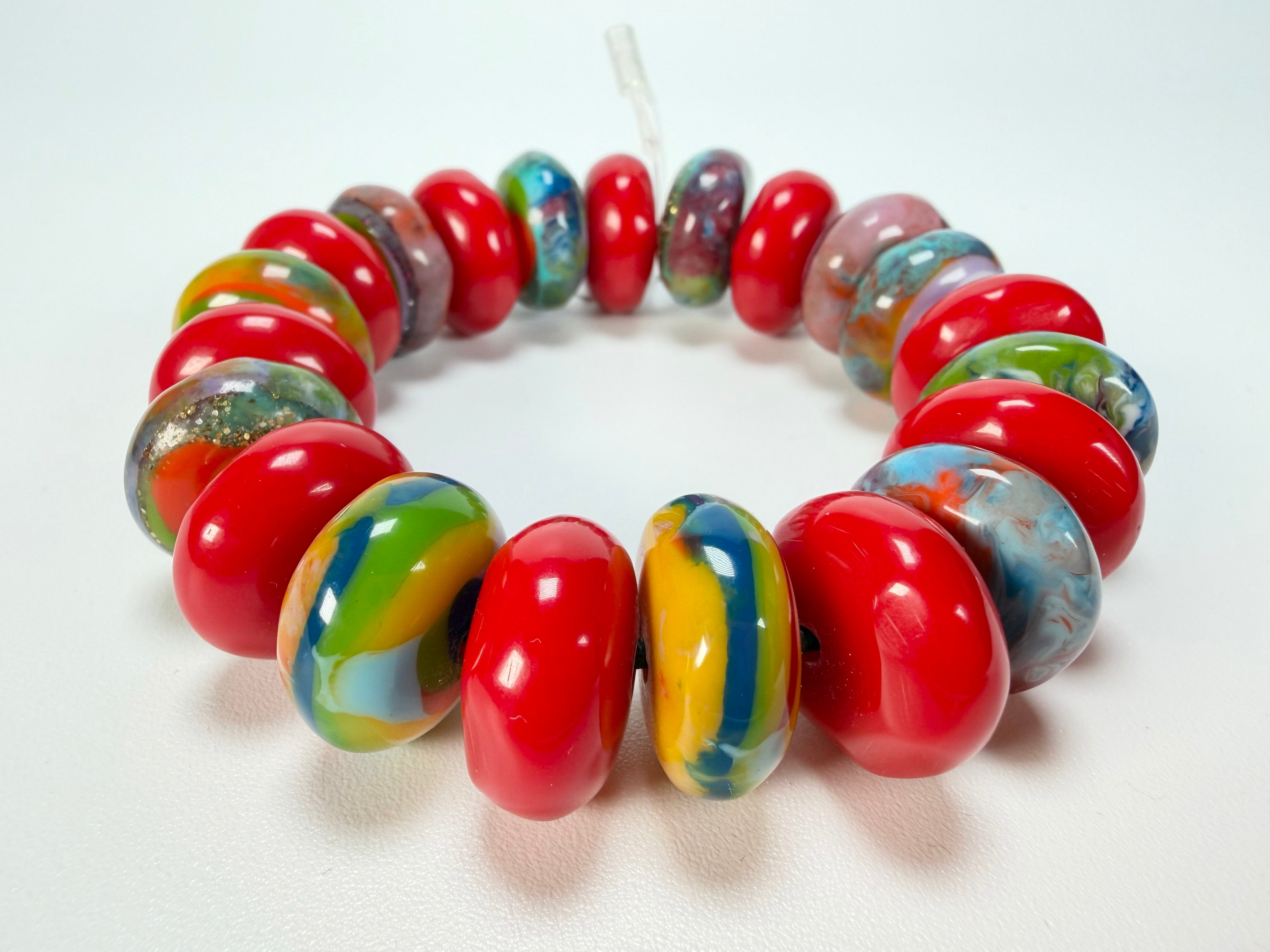 Jackie Brazil "Bela" Red Gloss & Kandinsky Elasticated Mini Wheels Resin Bracelet ( B0920 )