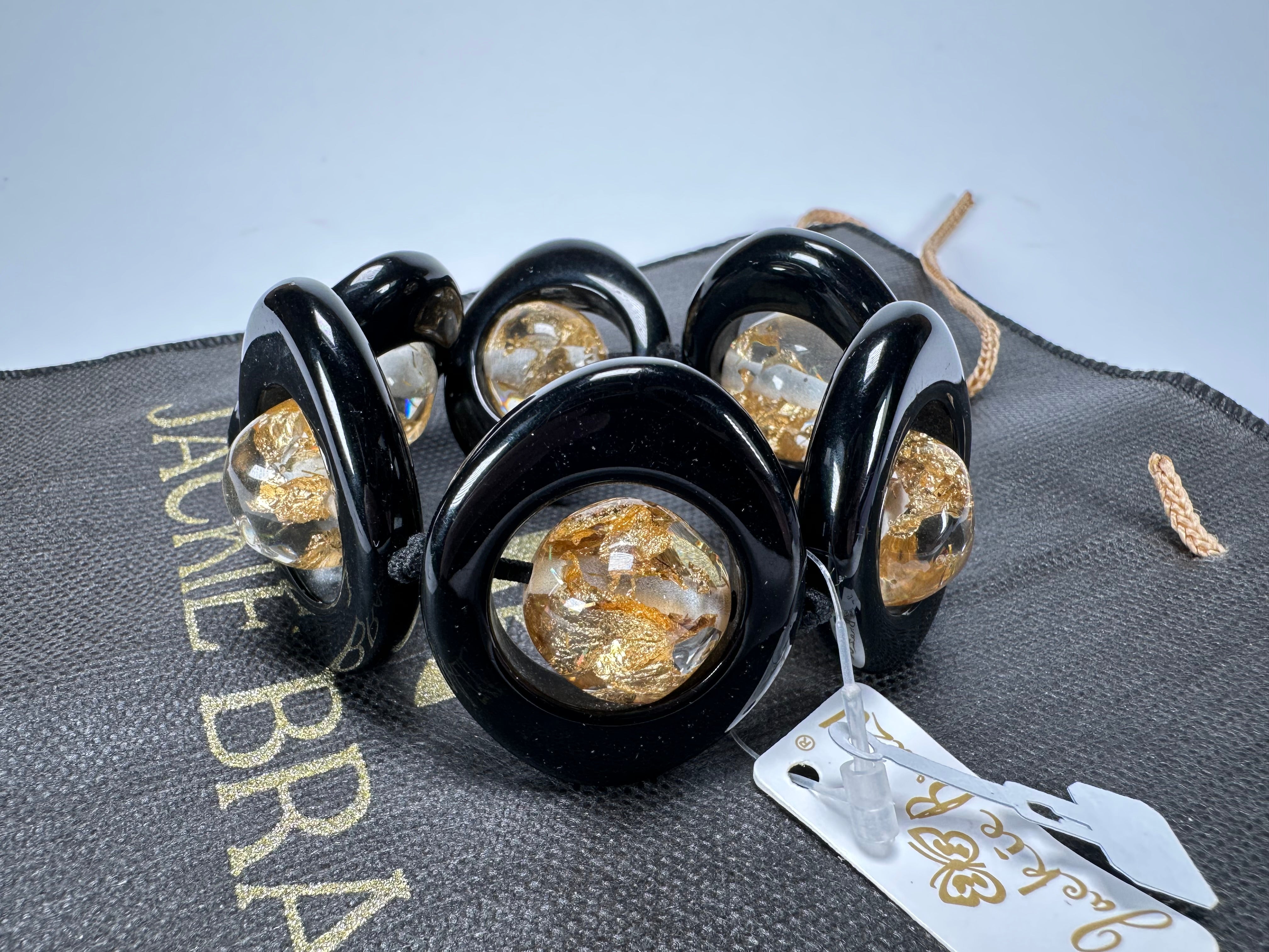 Jackie Brazil "Saturn" Black & Gold Flakes Disc & Ball Elastic Bracelet ( B0052 )