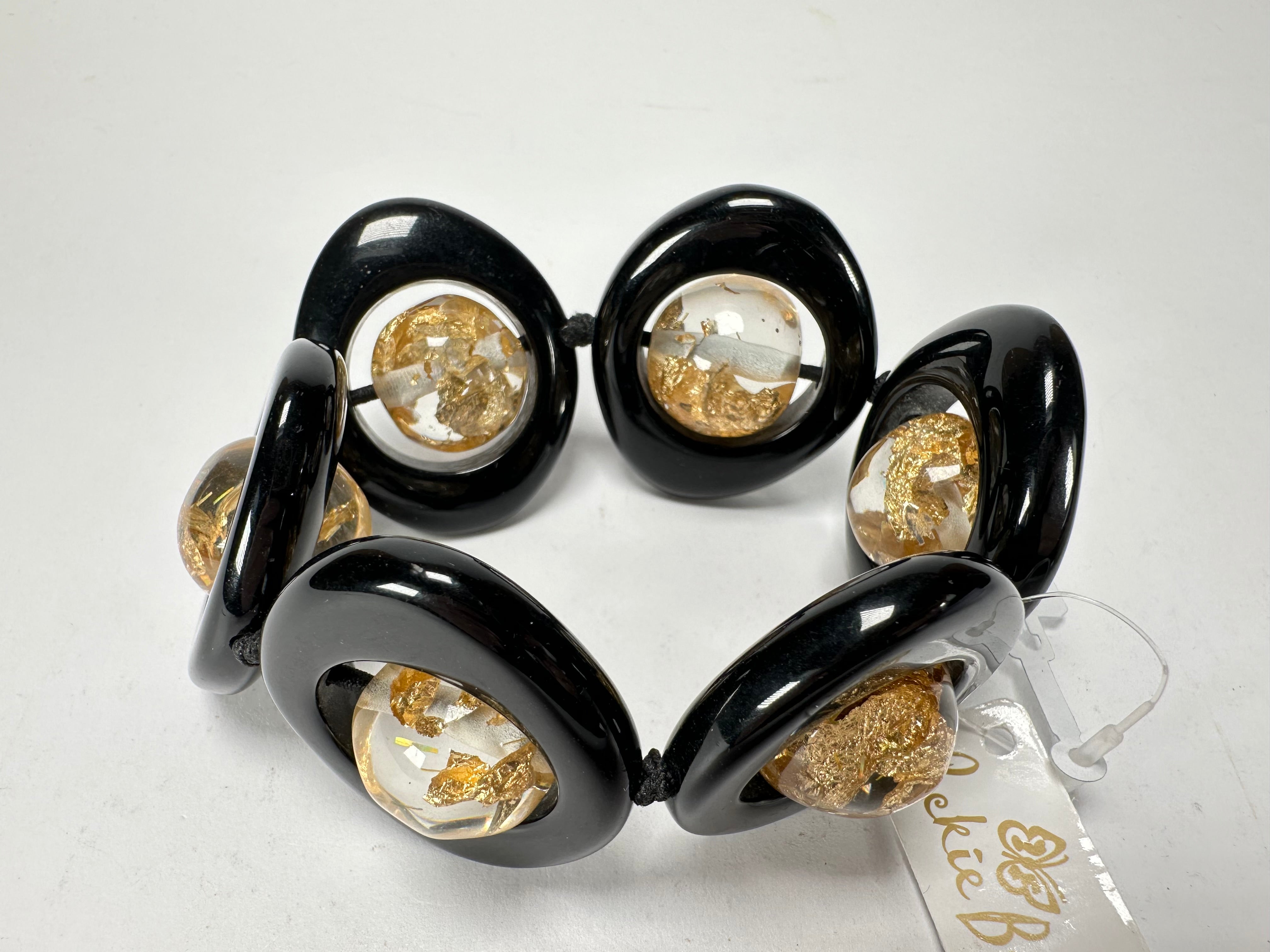 Jackie Brazil "Saturn" Black & Gold Flakes Disc & Ball Elastic Bracelet ( B0052 )