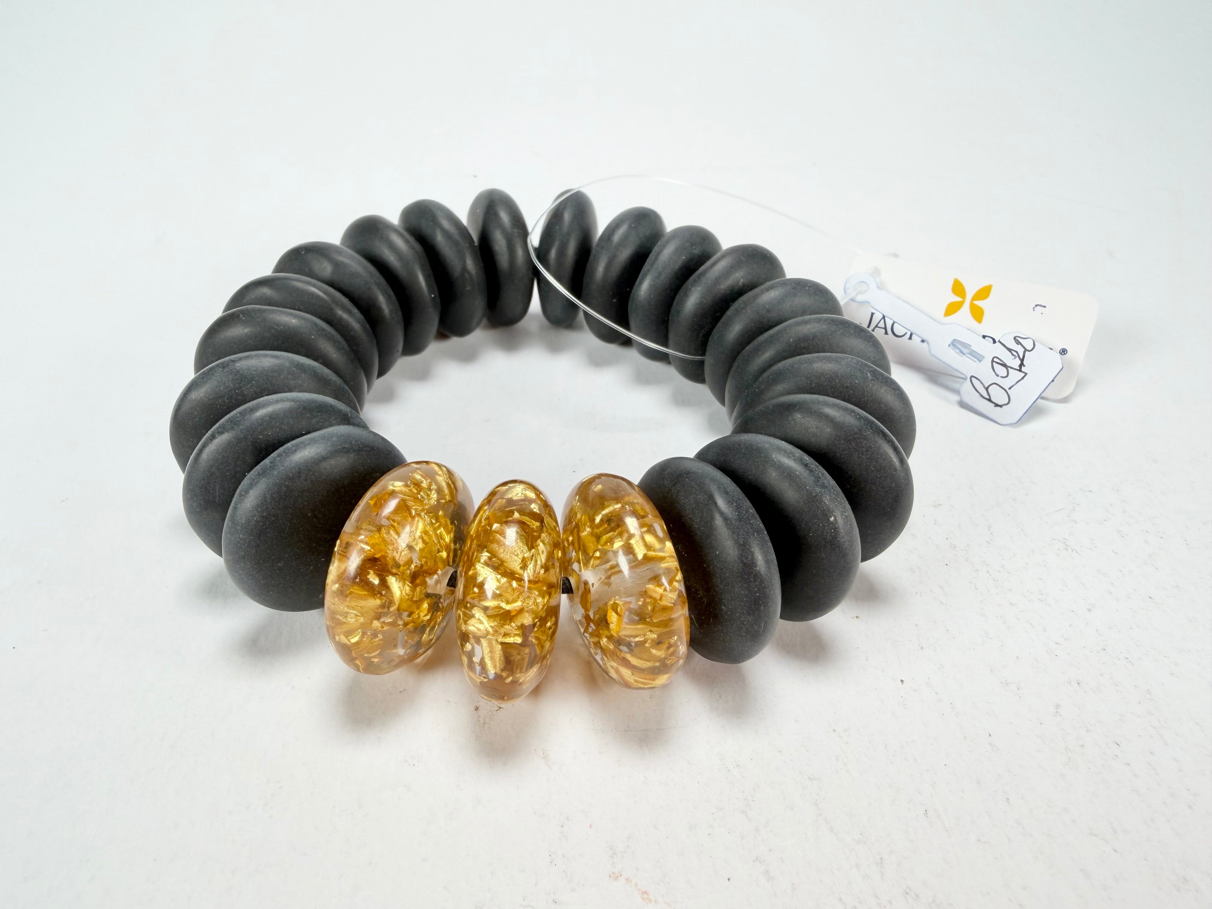 Jackie Brazil "Ana" Black Matt & Gold Flakes Mix Elasticated Wheels Resin Bracelet ( B0910 )