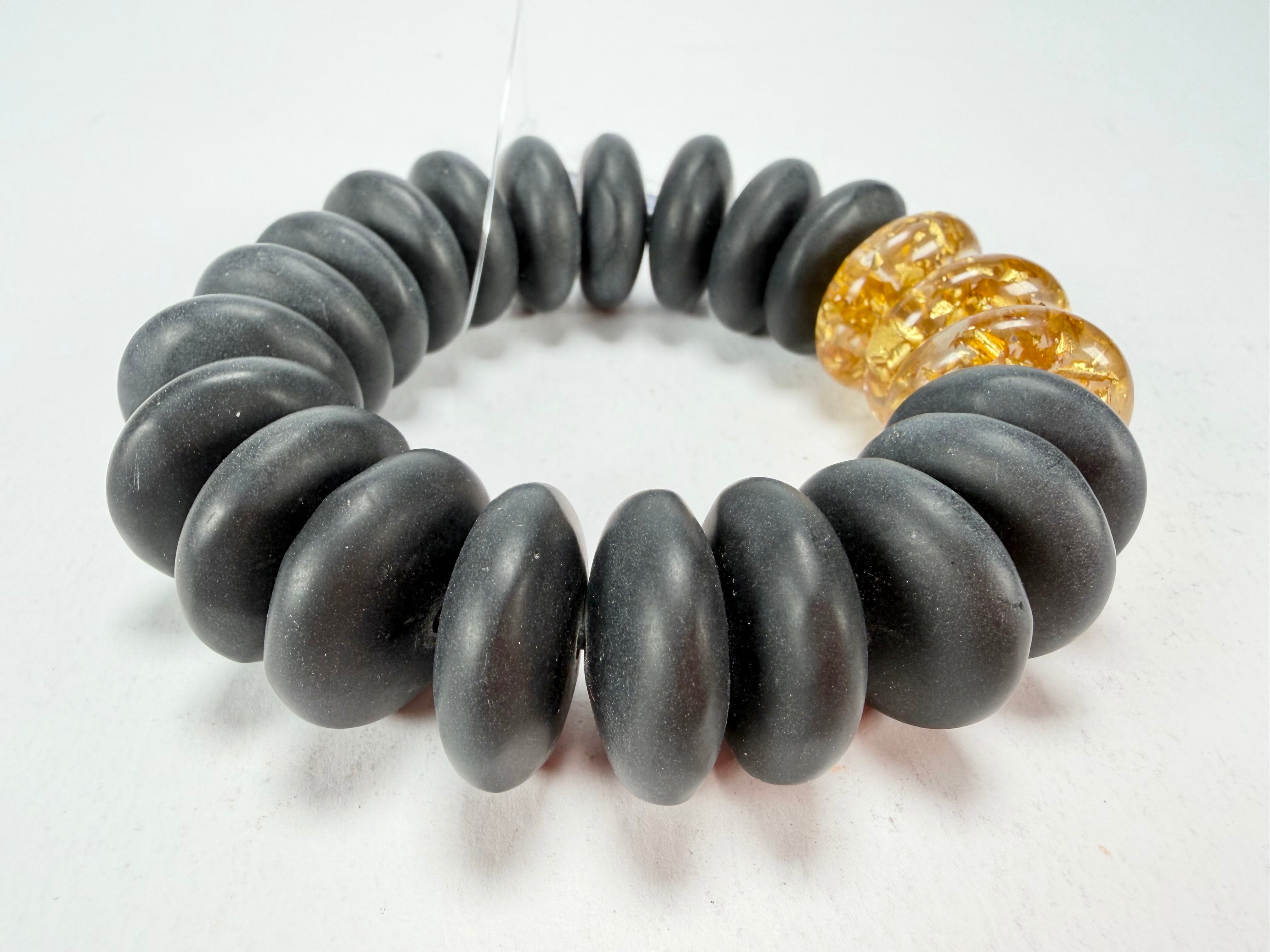 Jackie Brazil "Ana" Black Matt & Gold Flakes Mix Elasticated Wheels Resin Bracelet ( B0910 )