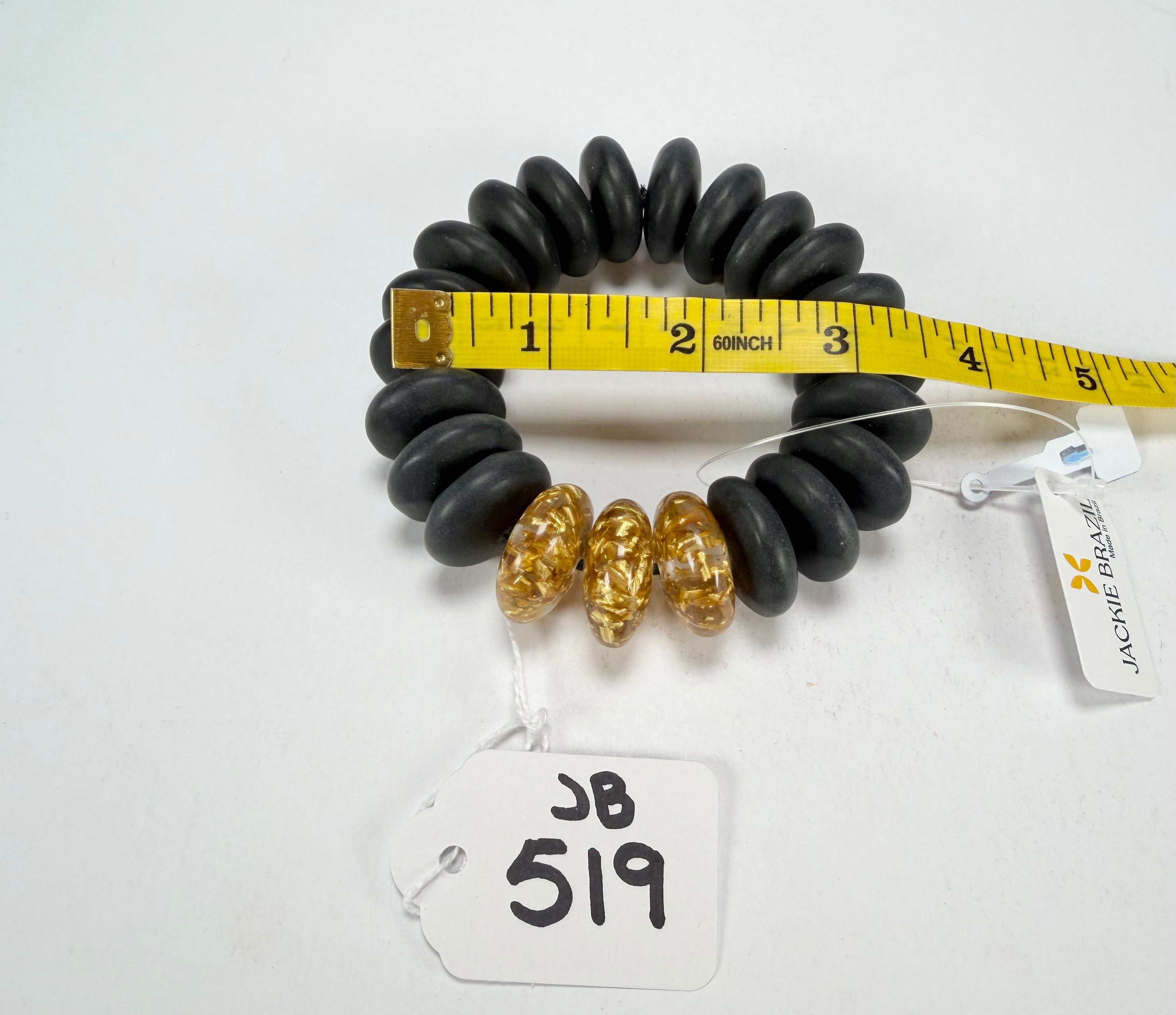 Jackie Brazil "Ana" Black Matt & Gold Flakes Mix Elasticated Wheels Resin Bracelet ( B0910 )