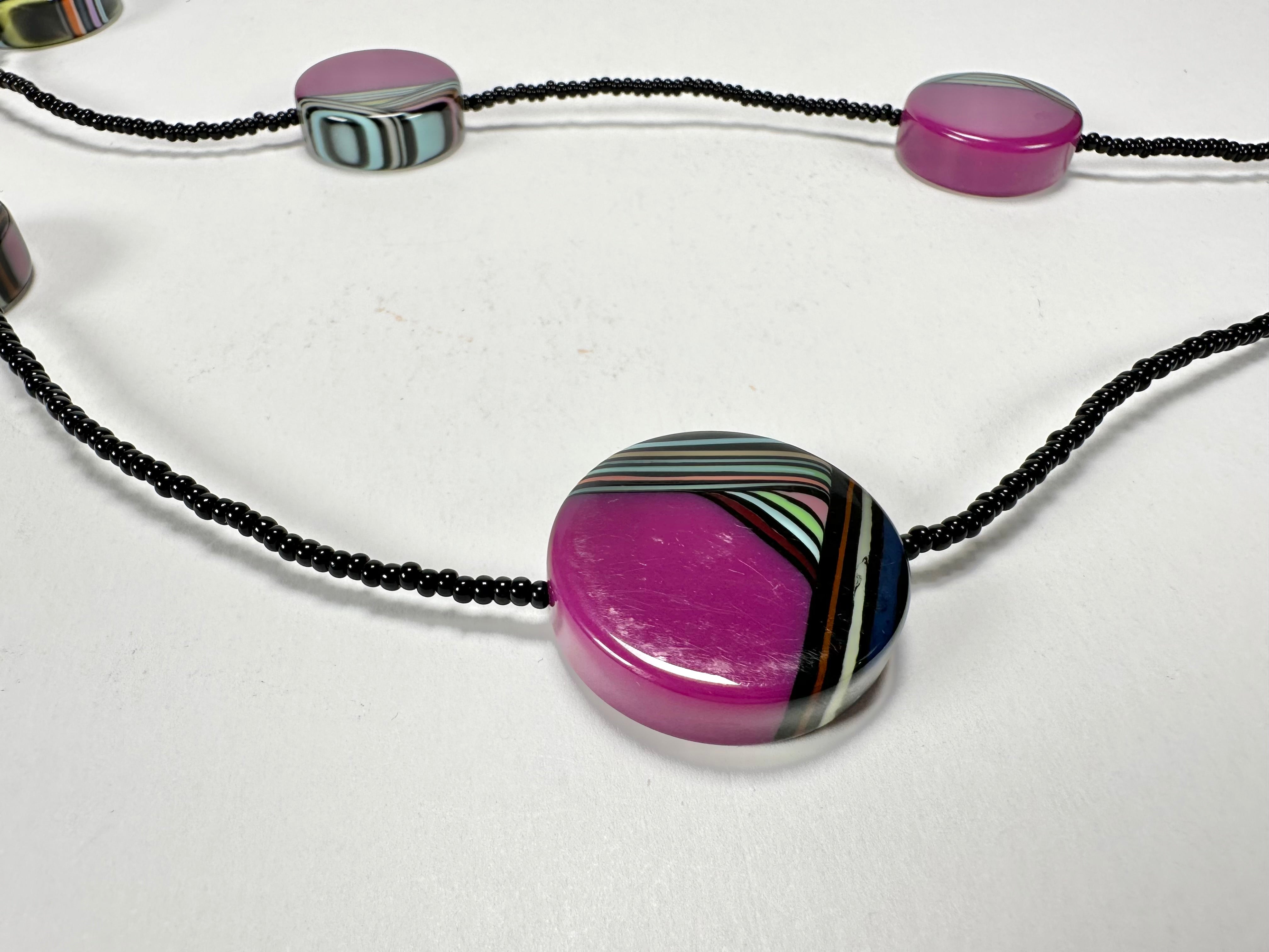 Jackie Brazil "Aida" Purple Swirls Discs With Beads Long Resin Necklace ( N3150 )